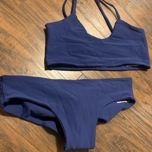 Fused 2 piece swimsuit (Top is a medium, bottoms are small)